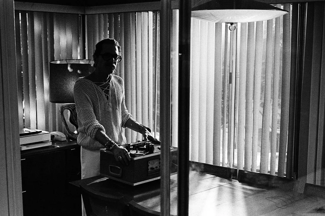 William Basinski beside a reel-to-reel tape machine