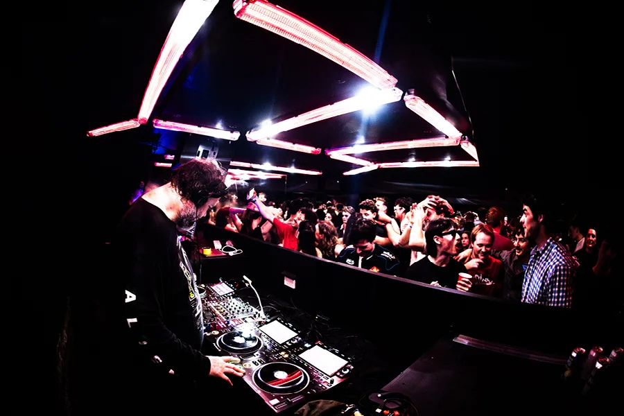 DJ playing to a crowd inside Chinese Laundry