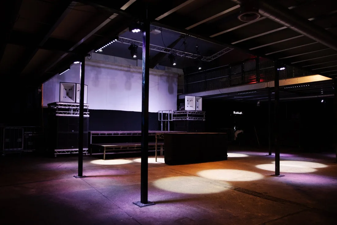 Colour Factory empty warehouse dancefloor with stage, speakers and mezzanine