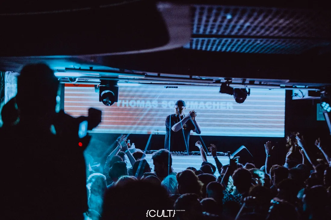 A performer and club-night crowd beneath lighting at CULT Sydney