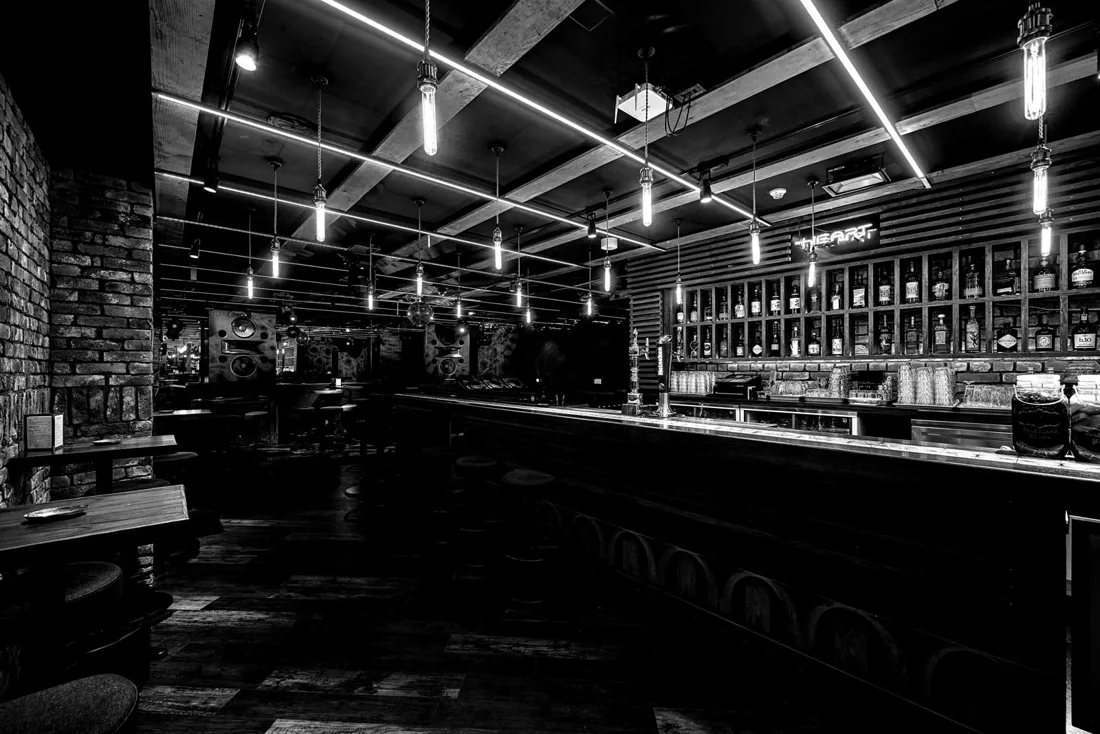 DJ BAR Bridge Shibuya long bar counter and liquor shelves, black and white