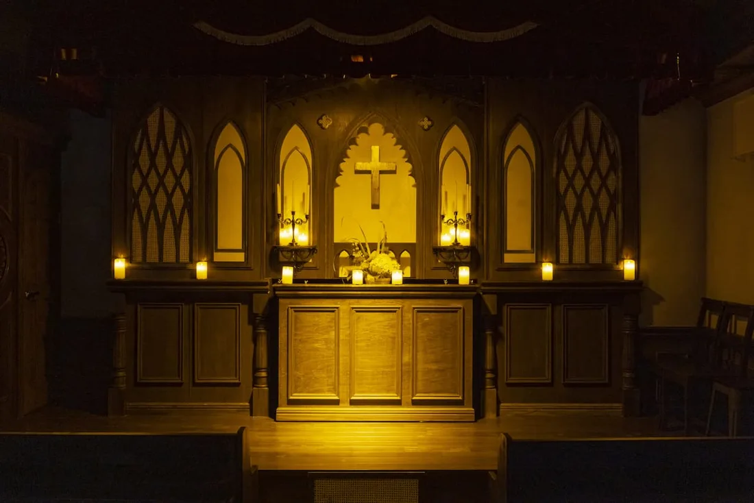 Dogenzaka Church church-style altar with candles and cross