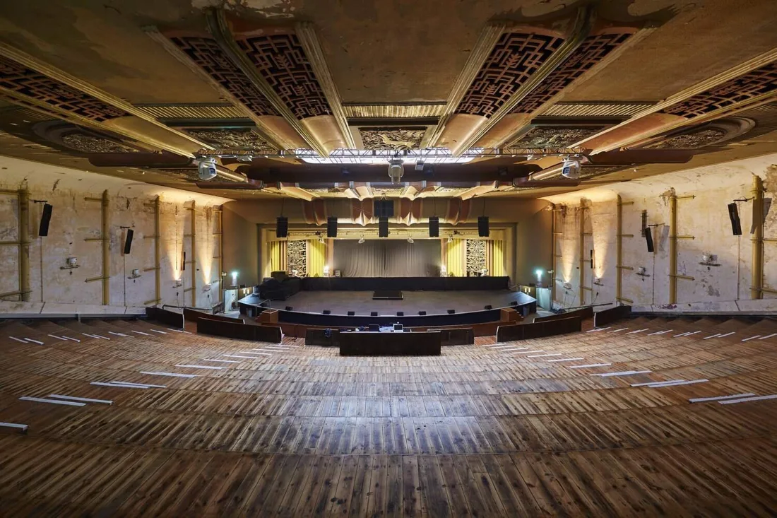 EartH art-deco theatre: raked wooden floor facing the stage