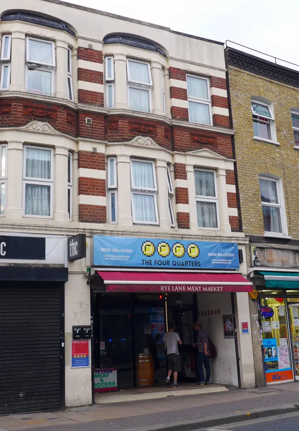 Four Quarters Rye Lane frontage under The Four Quarters banner