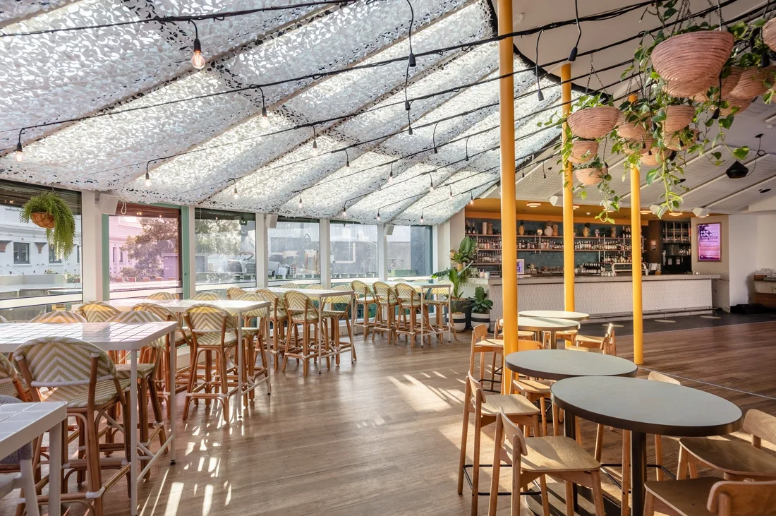 Hotel Steyne sunlit glass-roofed function room with timber floor and bar