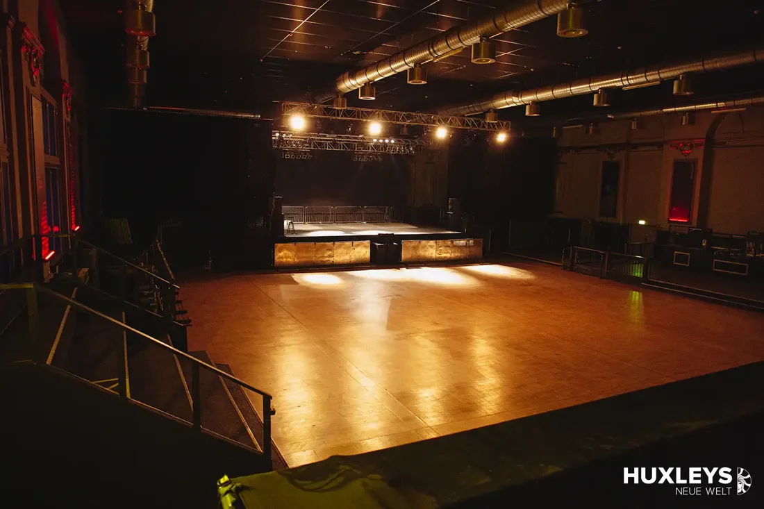 Huxley's Neue Welt empty main hall, wooden dancefloor, lit stage and balcony