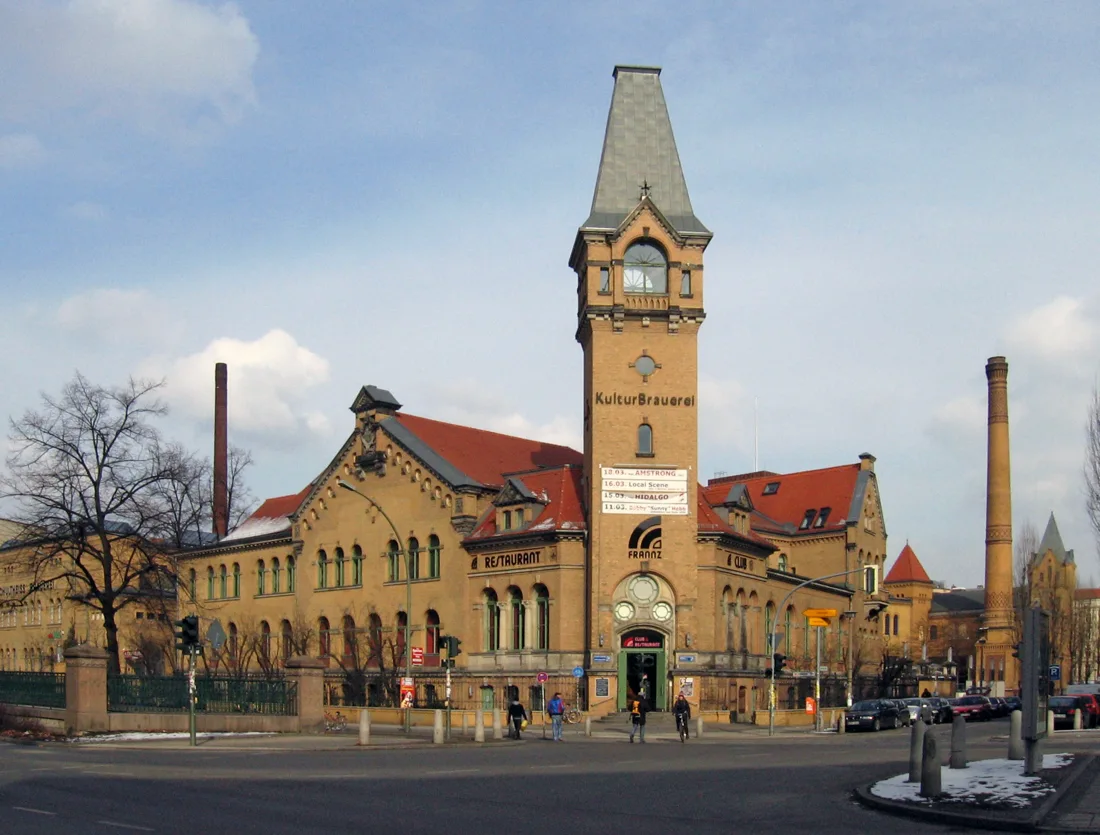 Kulturbrauerei yellow-brick brewery complex with its signed tower, winter daylight