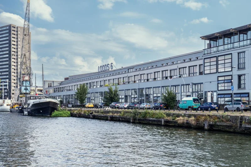 Loods6 long waterfront warehouse with LOODS 6 rooftop sign on the KNSM quay