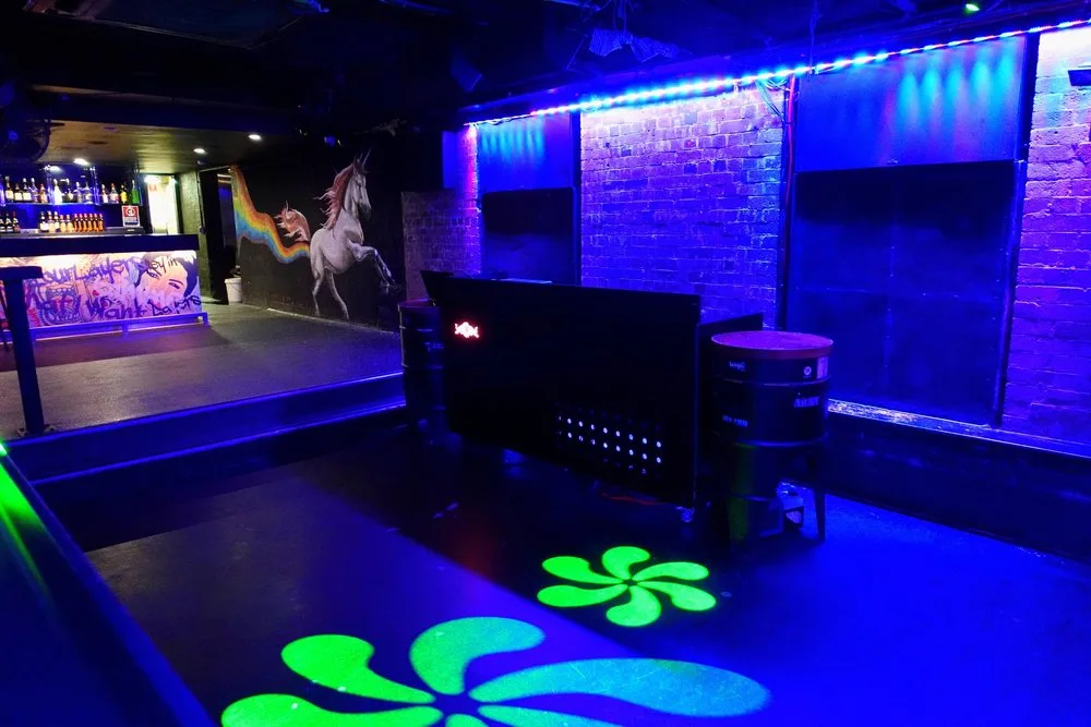 Oxford Underground basement club with DJ booth, dancefloor, bar and unicorn mural