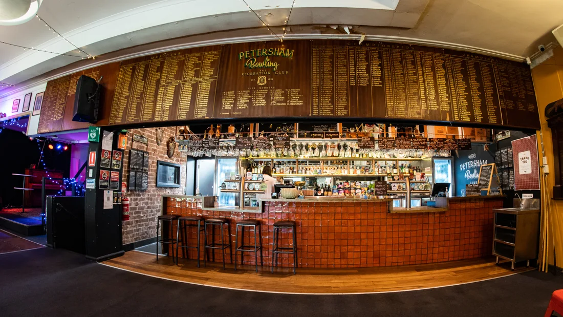 Petersham Bowling Club bar under honour boards bearing the club's name