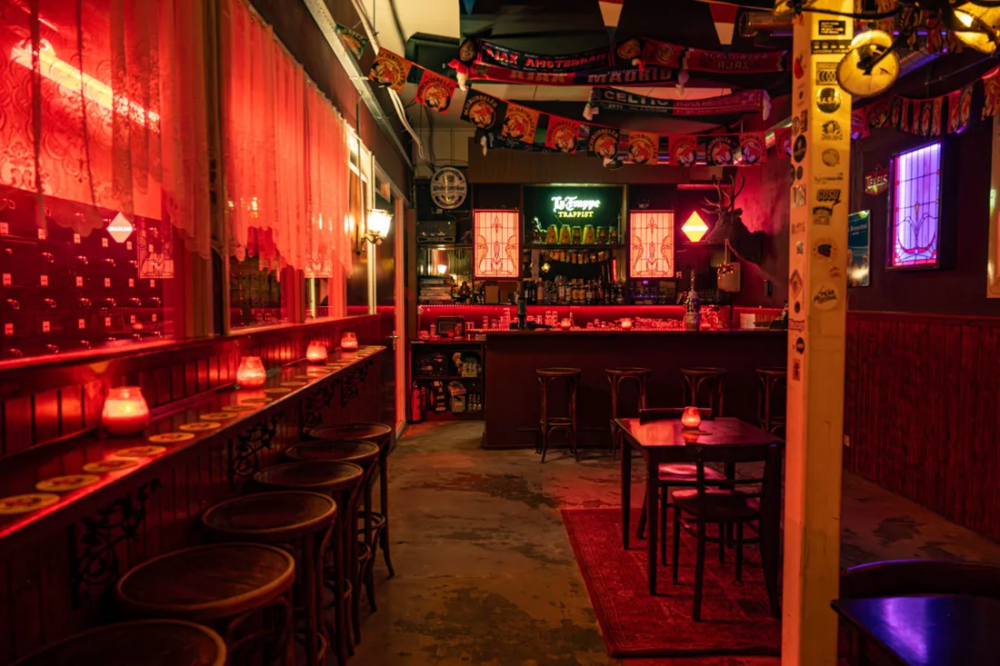 SISSI'S Amsterdam red-lit bar with stools, candles and football scarves