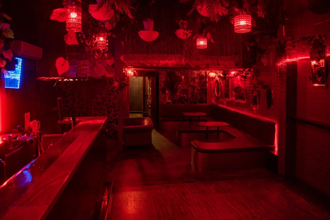 Sooki Lounge red-lit Jungle Bar with lanterns, foliage and booths