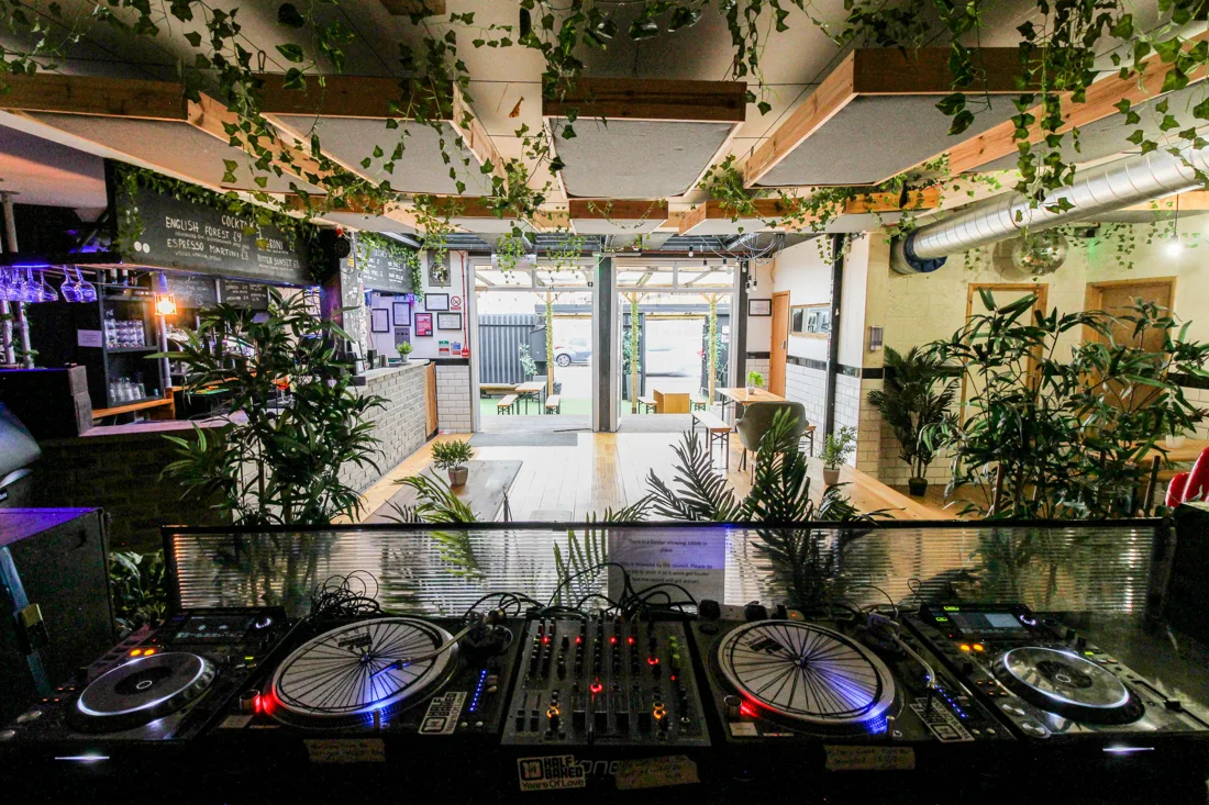 Starlane Pizza Bar decks overlooking the plant-filled bar room