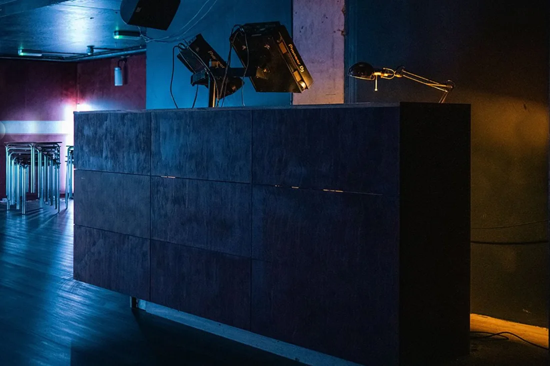 The Greyhound DJ booth with Pioneer decks beside the dancefloor