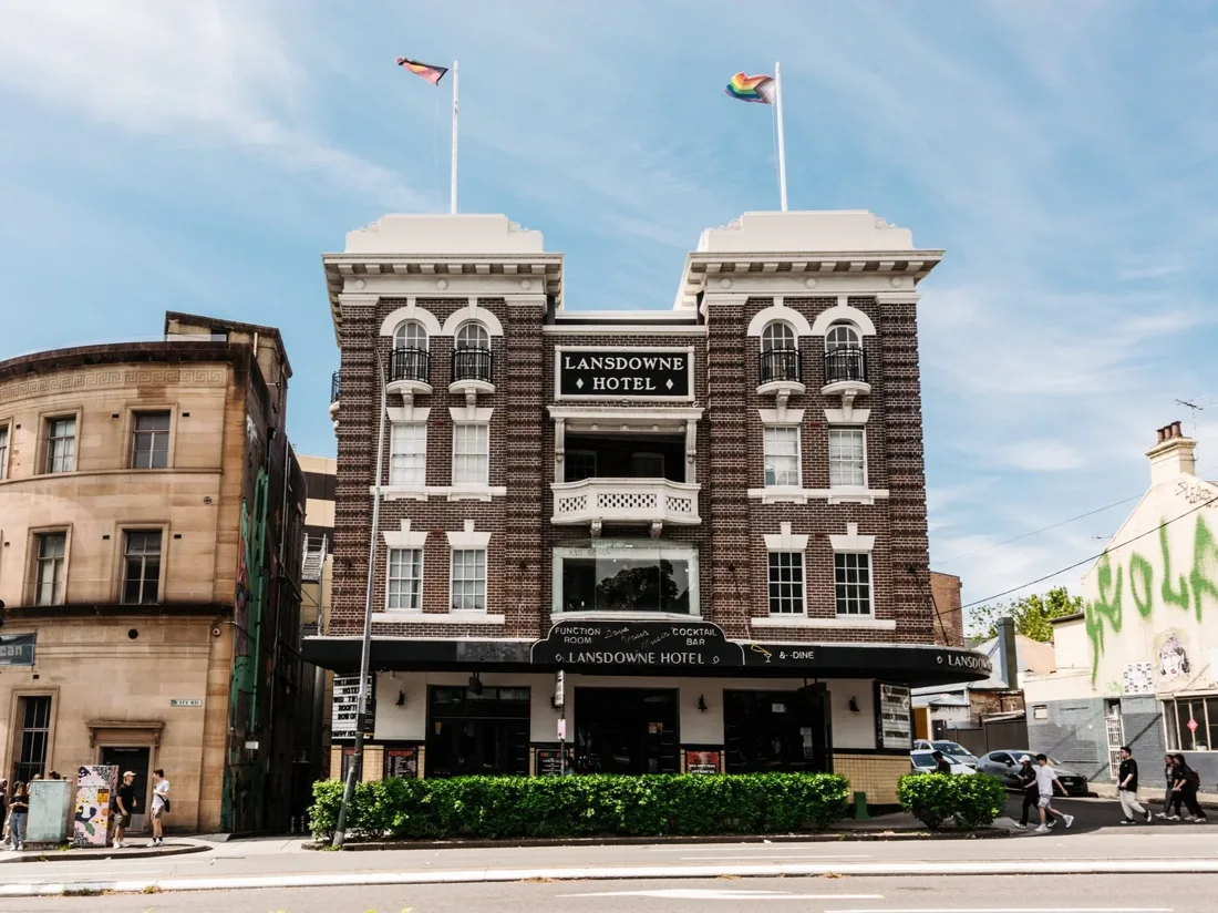 The Lansdowne brown-brick hotel on City Road with Lansdowne Hotel signs