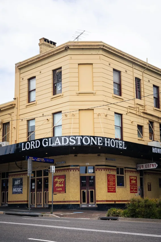 The Lord Gladstone yellow corner pub with Lord Gladstone Hotel sign