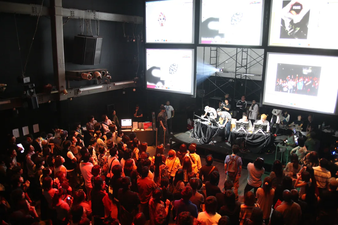 WOMB main room from above, crowd before stage and projection screens