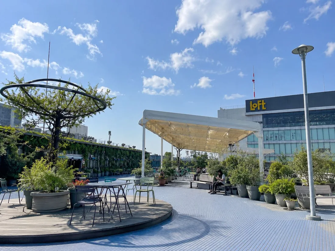 Yodo Groove rooftop terrace with planters, seating and shade canopy