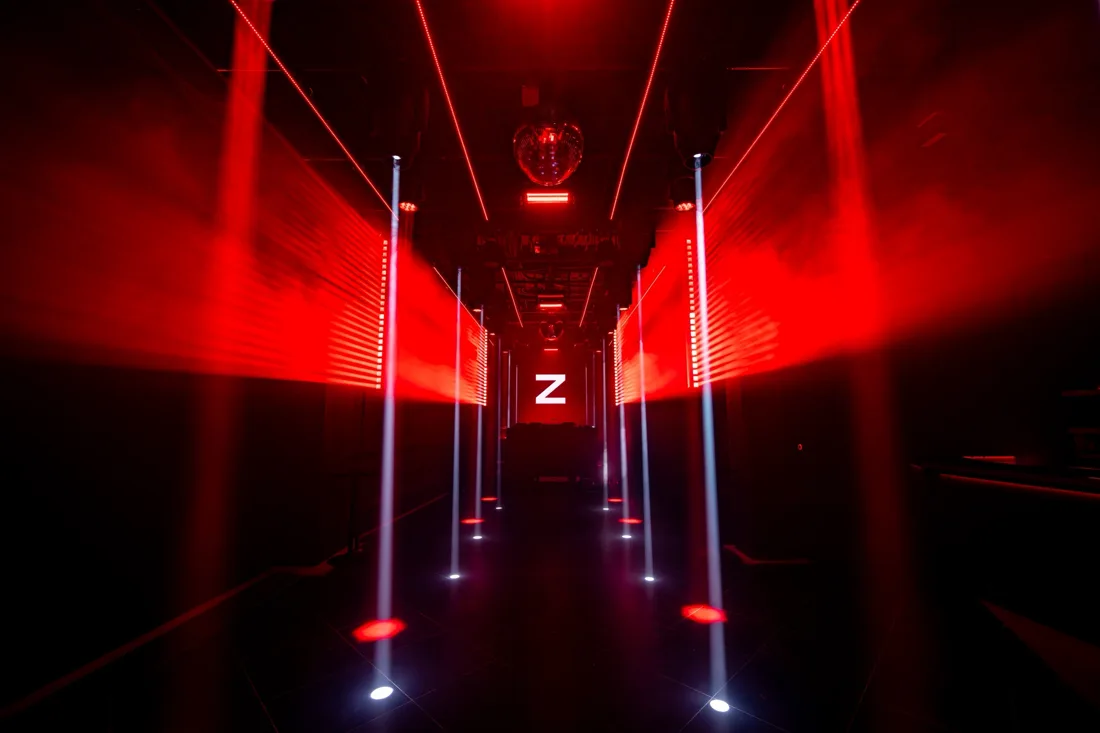 Z Maruyama main dancefloor with red lasers, mirror ball and Z screen